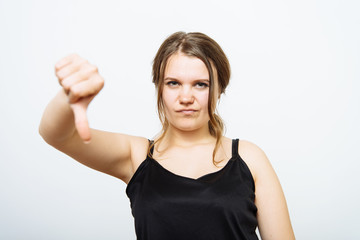 Woman showing a thumb down gesture