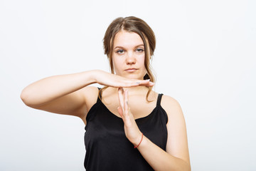 Girl making time out gesture