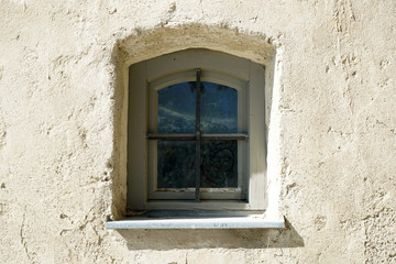 old window in a stone wall