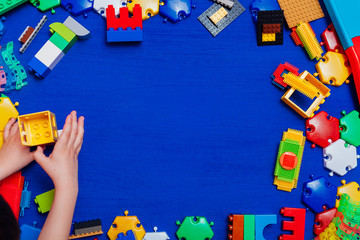 Multi-colored children's development games designer toys on a blue background