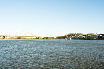 Naklejka premium Cityscape of the city of Nijmegen with the bridge Waalbrug at the river Waal, Netherlands