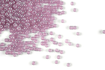 Isolated beads on a white background, scattered beads, purple beads