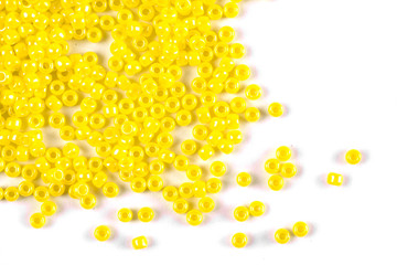 Isolated beads on a white background, scattered beads, yellow beads