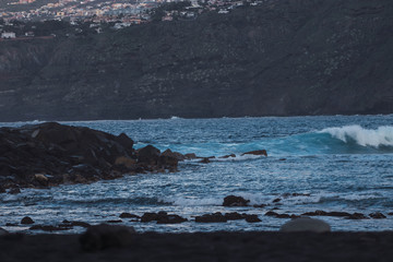waves crashing on rocks, in the canary islands