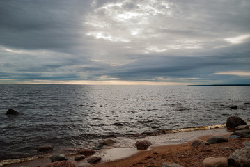 The sun breaks through the clouds in the Gulf of Finland