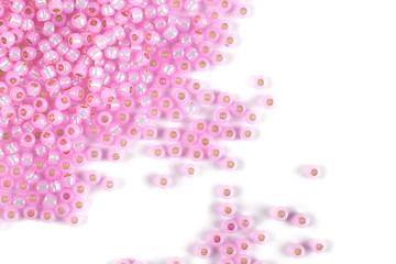 Isolated beads on a white background, scattered beads, pink beads