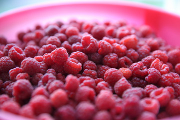 Raspberry berries in a bucket. Top view.