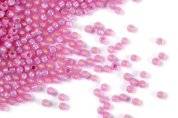 Isolated beads on a white background, scattered beads, pink beads