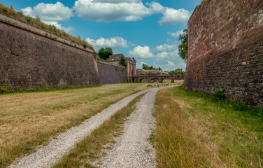 Fototapeta na wymiar View of the ultimate Vauban star fortress at Neuf Brisach France next to the Rhine river with large masonry cannon bastions, embrasures, ditches