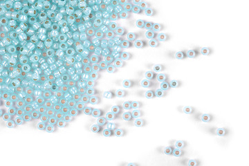 Isolated beads on a white background, scattered beads, blue beads