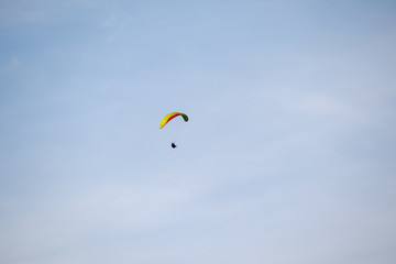 Panorama of the Austrian Alps,Europe,at Lake Ossiacher See with the mountains of the Karawanken Mountains with paragliders