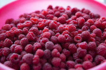 Raspberry berries in a bucket. Top view.
