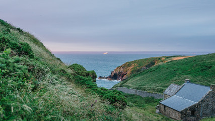 Sunset view over Dale Princess port starting point in St. Brides Bay from the hill side in Martin's Haven in Pembrokeshire, West Wales.