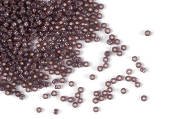 Isolated beads on a white background, scattered beads, brown beads