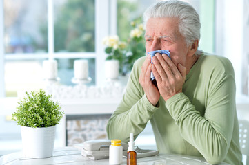 Close up portrait of sad sick senior man