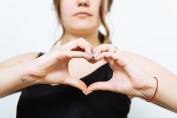 woman making a hand heart frame