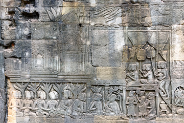 Picturial stories carved into the wall at the Unesco World Heritage site of Ankor Thom, Siem Reap, Cambodia