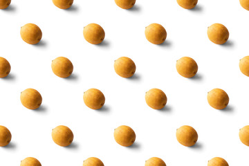 Dried lemon pattern on a white background. Food texture. Seamless texture of lemon.