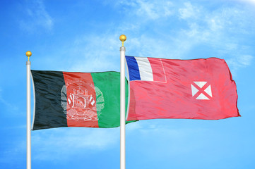 Afghanistan and Wallis and Futuna  two flags on flagpoles and blue cloudy sky