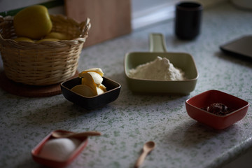 
Ingredients for shortbread cookies on the kitchen counter. Light from a window illuminates the...