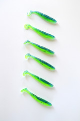 Silicone fishing lures. Lures for catching fish from edible rubber. Colorful baits. Isolated on...