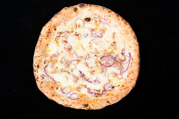 italian pizza cheese and onions on a black background