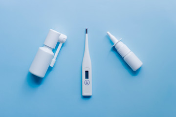 Medical supplies lie on a blue light background.