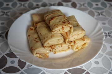 pancakes stuffed on a white plate