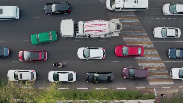The large number of cars stand on the freeway and honk in a traffic jam