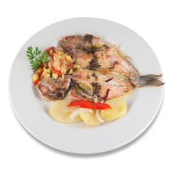Plate of baked gilt-head sea bream with baked potatoes.