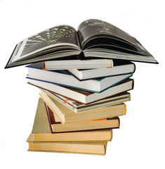 A large stack of thick terribly interesting and educationally useful books on various topics tastes and wishes of readers on a white background