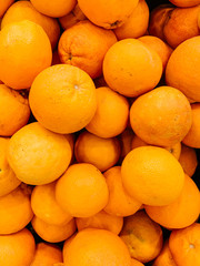 lots of ripe delicious oranges for eating like a background