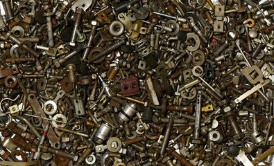 a lot of metal rusty bolts, nuts, washers. background for design. Backdrop ideas. small used steel parts