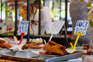 Cooked chicken and duck for sale at a street food market, Thailand.