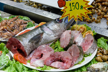 Barracuda cut into steaks for sale at a fish market, Thailand