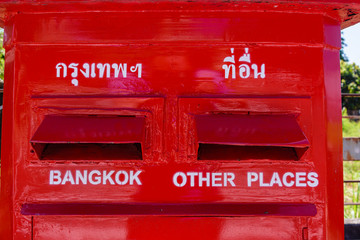 Red postbox with slots for Bangkok and 