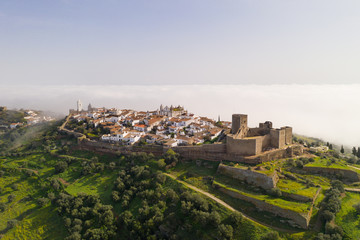 Monsaraz drone aerial view on the clouds in Alentejo, Portugal