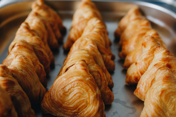 Set of coffee break in the hotel during conference meeting, with tea and coffee catering, decorated catering banquet table with variety of different pastry and bakery, with croissants and cookies