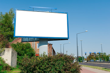 Blank white advertising billboard near the city street - obrazy, fototapety, plakaty