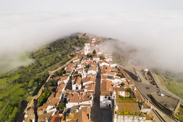Obraz premium Monsaraz drone aerial view on the clouds in Alentejo, Portugal