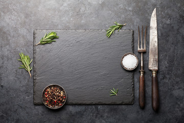 Stone board with spices and utensils