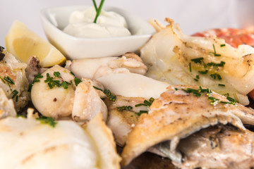 Grilled fish dish with cuttlefish, prawns, hake, sole and squid.