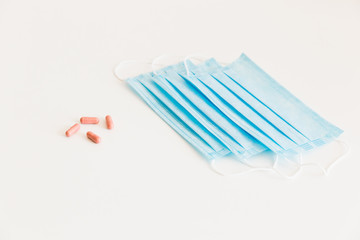 Disposable medical face mask. Prevention of the Covid-19 pandemic virus. Antiviral medical mask for protection from flu diseases. Medical respiratory and tablets