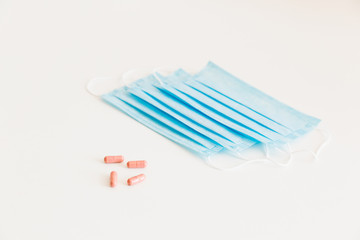Disposable medical face mask. Prevention of the Covid-19 pandemic virus. Antiviral medical mask for protection from flu diseases. Medical respiratory and tablets