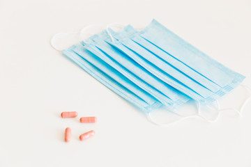 Disposable medical face mask. Prevention of the Covid-19 pandemic virus. Antiviral medical mask for protection from flu diseases. Medical respiratory and tablets