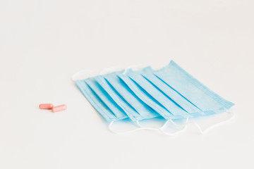 Disposable medical face mask. Prevention of the Covid-19 pandemic virus. Antiviral medical mask for protection from flu diseases. Medical respiratory and tablets