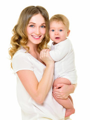 Mother and baby playing and smiling. Happy family.