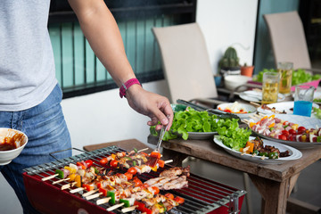 Barbeque Grill Street Food in thailand,Eat outdoors in a happy family.