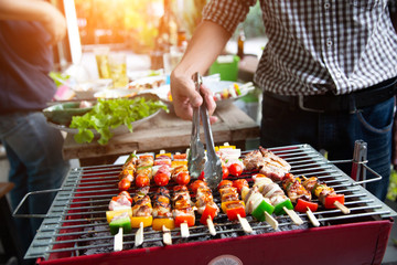 Barbeque Grill Street Food in thailand,Eat outdoors in a happy family.