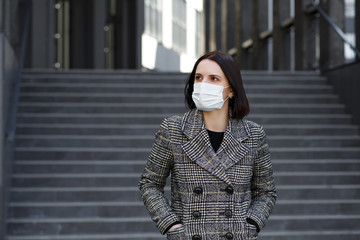 Girl in a medical mask. Stay at home. Pandemic coronavirus. COVID-19. SARS-CoV-2. 2019-nCoV